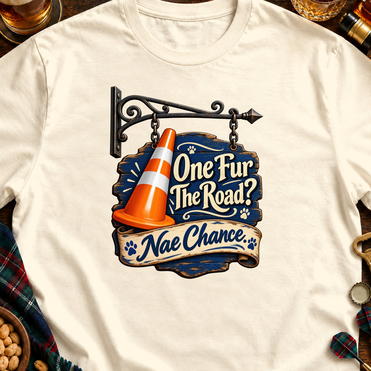 Cream t-shirt with graphic: traffic cone, wooden sign, and text "One Fur The Road? Nae Chance."