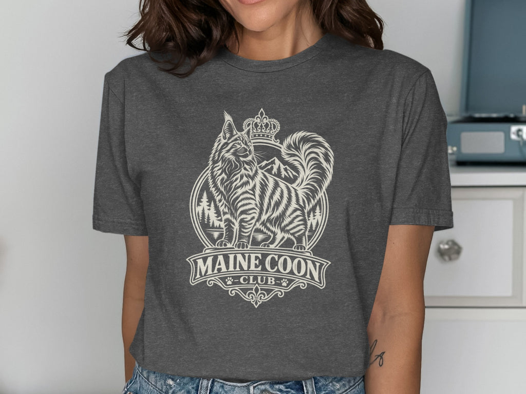T-shirt featuring a Maine Coon cat with crown, mountains, and "MAINE COON - CLUB -" text.