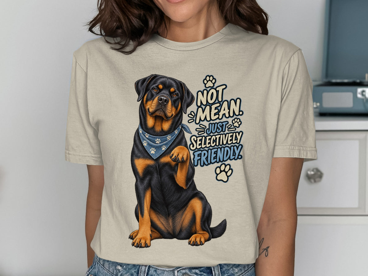 Rottweiler with bandana wearing t-shirt saying "Not Mean. Just Selectively Friendly."
