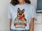 German Shepherd graphic with text "My Shepherd Runs This House" on a light blue shirt.