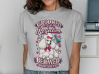 White poodle graphic with text "Groomed to Perfection Behaved by Accident."