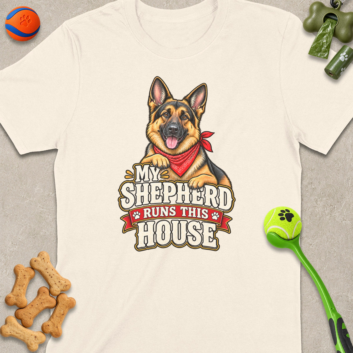 German Shepherd graphic with text "My Shepherd Runs This House" on a cream t-shirt.