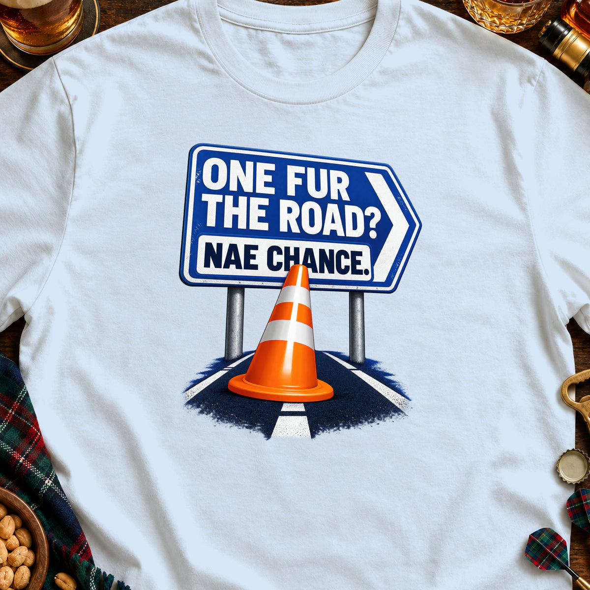 Blue sign with text "ONE FUR THE ROAD? NAE CHANCE." above an orange traffic cone.