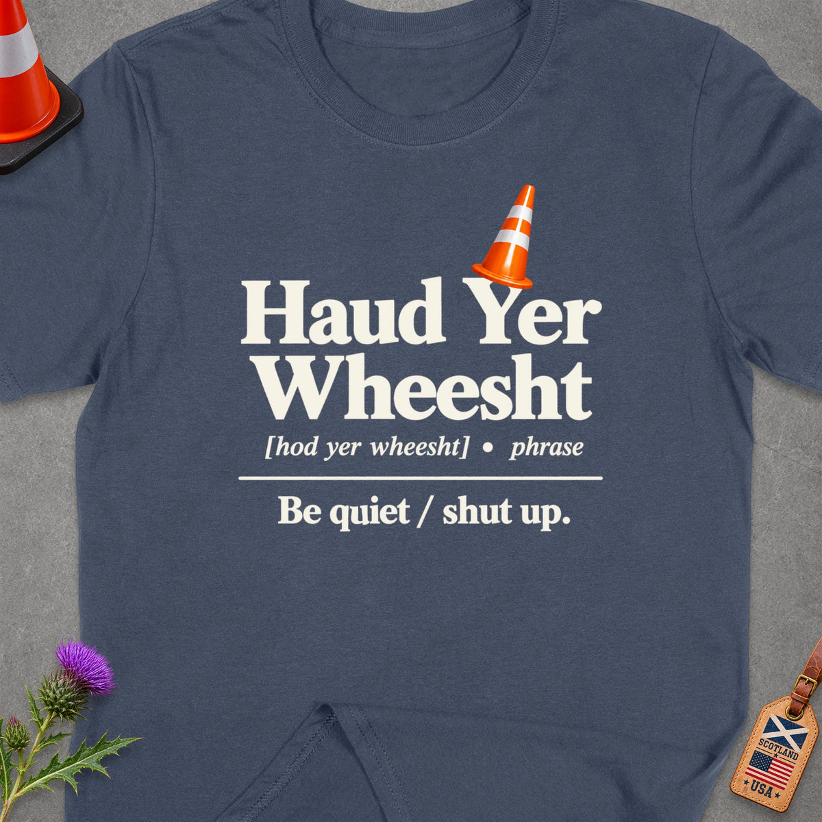 Navy t-shirt with "Haud Yer Wheesht" and its definition.
