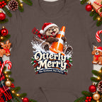 Otter wearing Santa hat holding orange cone, text "Otterly Merry Nae Scotland, Nae Party".