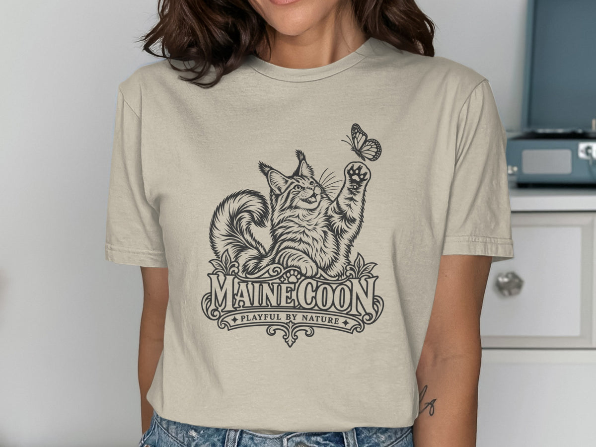 Maine Coon cat illustration with butterfly and text "MAINE COON PLAYFUL BY NATURE".