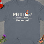 T-shirt with "Fit Like? [fit laik] • phrase How are you?" text.