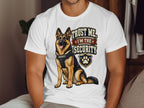 German Shepherd with "Trust Me, I'm The Security" text on a t-shirt.