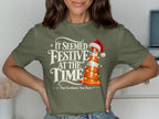 Green t-shirt with "It Seemed Festive At The Time" and a traffic cone.
