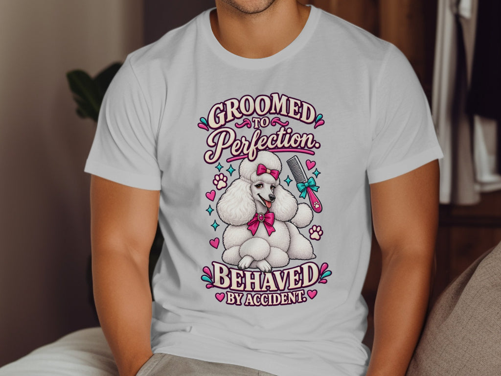 White t-shirt with "GROOMED TO PERFECTION" and a poodle.