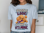 Light blue t-shirt with "Poodle Logic: If I want it, it's mine." and a poodle holding a toy.