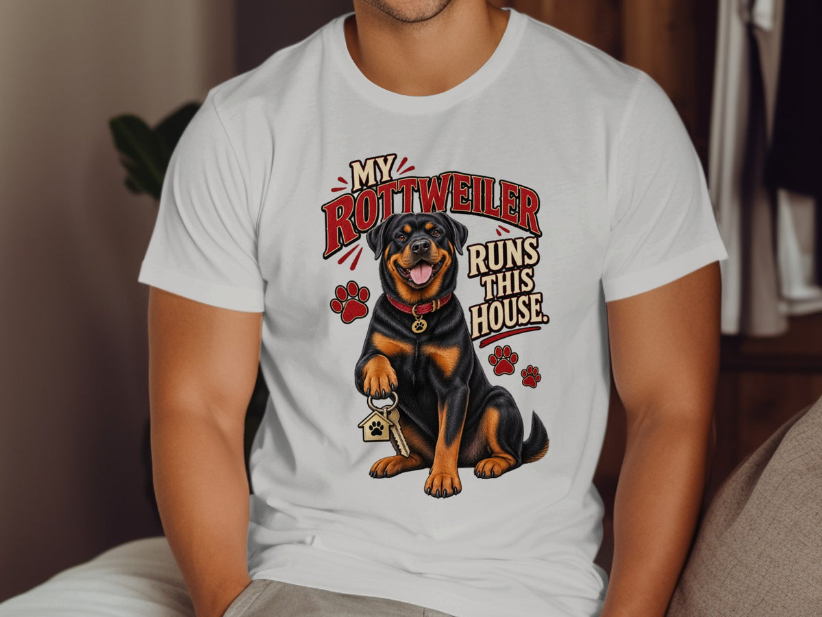 Rottweiler dog with keys and paw prints on a white t-shirt reading "My Rottweiler Runs This House."