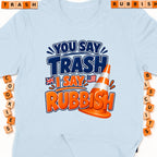 Light blue t-shirt with "You say Trash, I say Rubbish" text and a traffic cone.