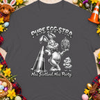 Cartoon bunny holding ornate egg, chick, and traffic cone with text "PURE EGG-STRA Nae Scotland, Nae Party."