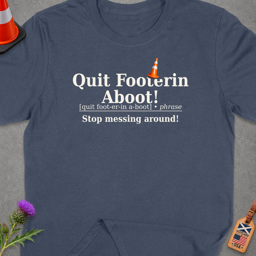 Dark blue t-shirt with "Quit Footerin Aboot!" and definition.