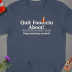 Dark blue t-shirt with "Quit Footerin Aboot!" and definition.
