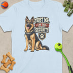 German Shepherd wearing a security vest with text "Trust Me, I'm the Security".