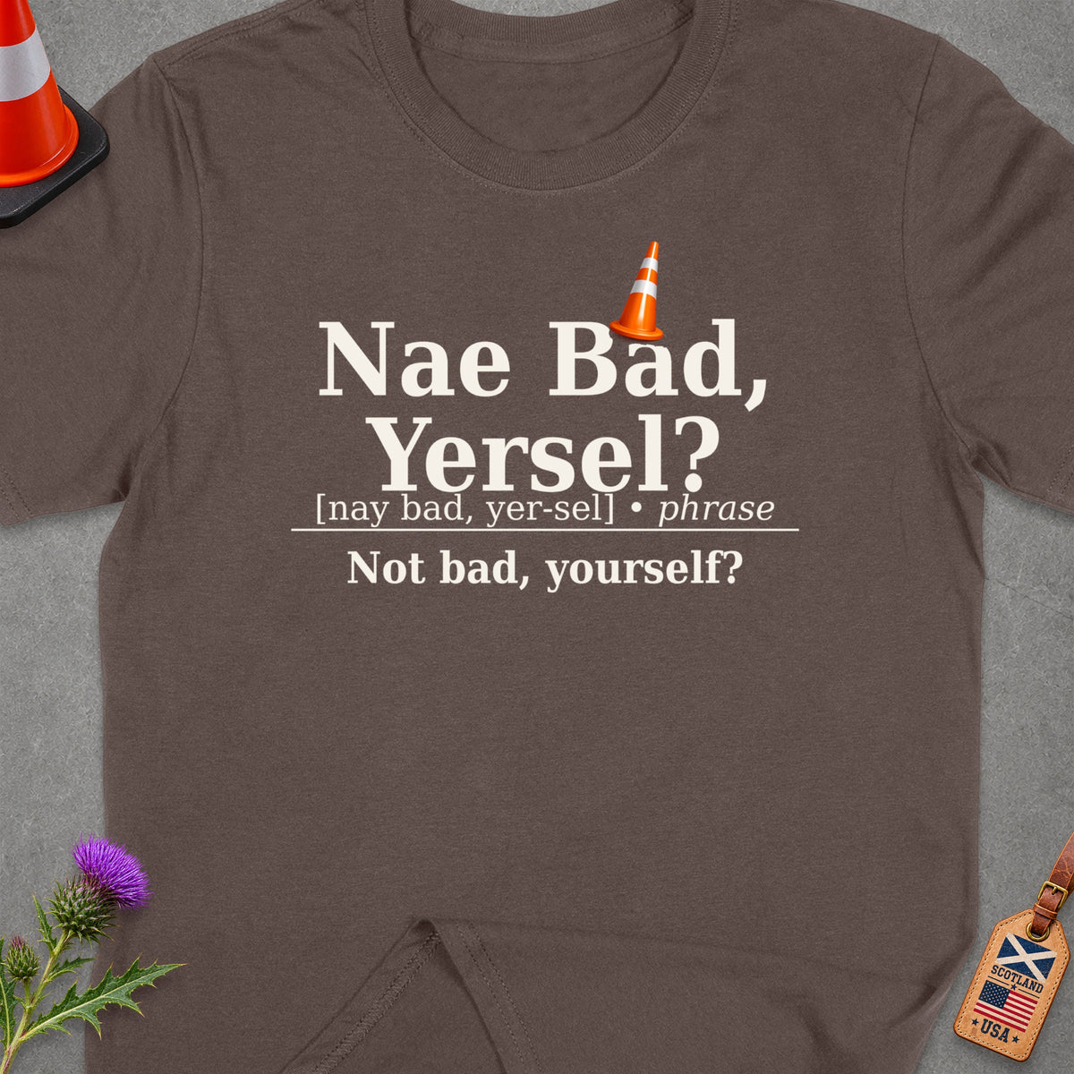 Brown t-shirt with "Nae Bad, Yersel?" and its translation.
