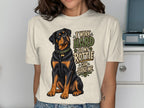 Rottweiler graphic on t-shirt with text "I work hard so my Rottie can judge me."