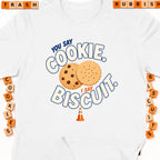 White t-shirt graphic: "You say cookie. I say biscuit." with two cookies.