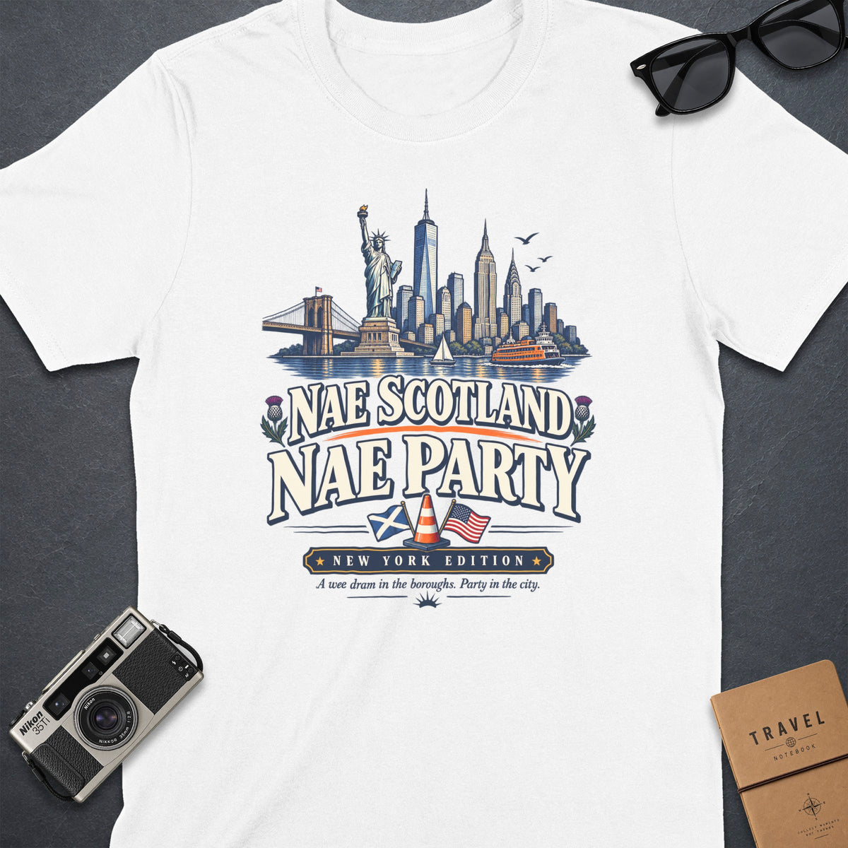 White t-shirt with New York City skyline and Scottish flag graphic.