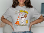 White t-shirt with cartoon rabbit, chick, traffic cone, and ornate egg. Text reads "PURE EGG-STRA" and "Nae Scotland, Nae Party."