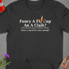 Dark t-shirt with text: "Funcy A Fly Cup An A Claik?", pronunciation, and translation.