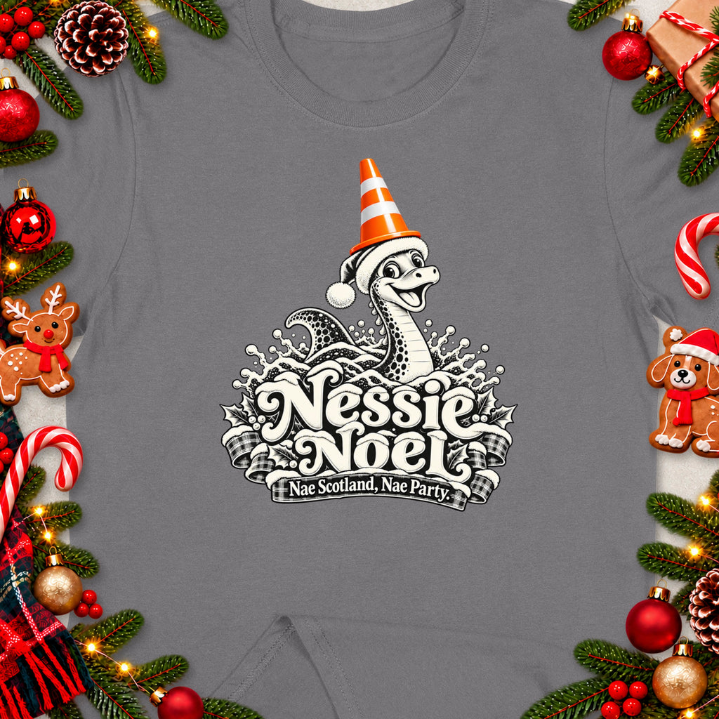 Nessie Noel design on gray t-shirt with holiday decorations and text.