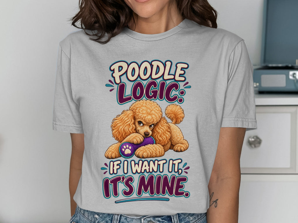Poodle with toy and text "Poodle Logic: If I want it, it's mine."