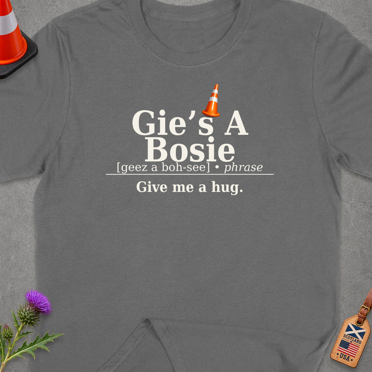 Dark grey t-shirt with "Gie's A Bosie" and "Give me a hug." text.