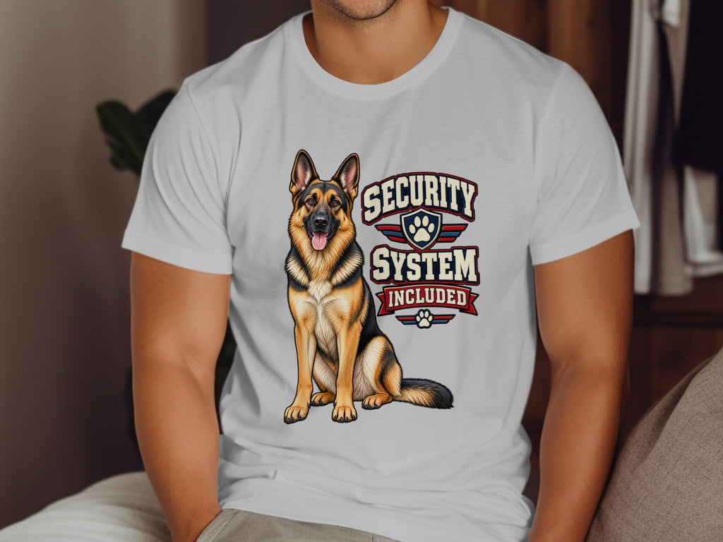 German Shepherd graphic with text "Security System Included" on a white t-shirt.