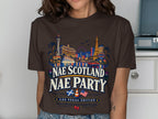 Brown t-shirt with Las Vegas skyline graphic and "Nae Scotland Nae Party" text.