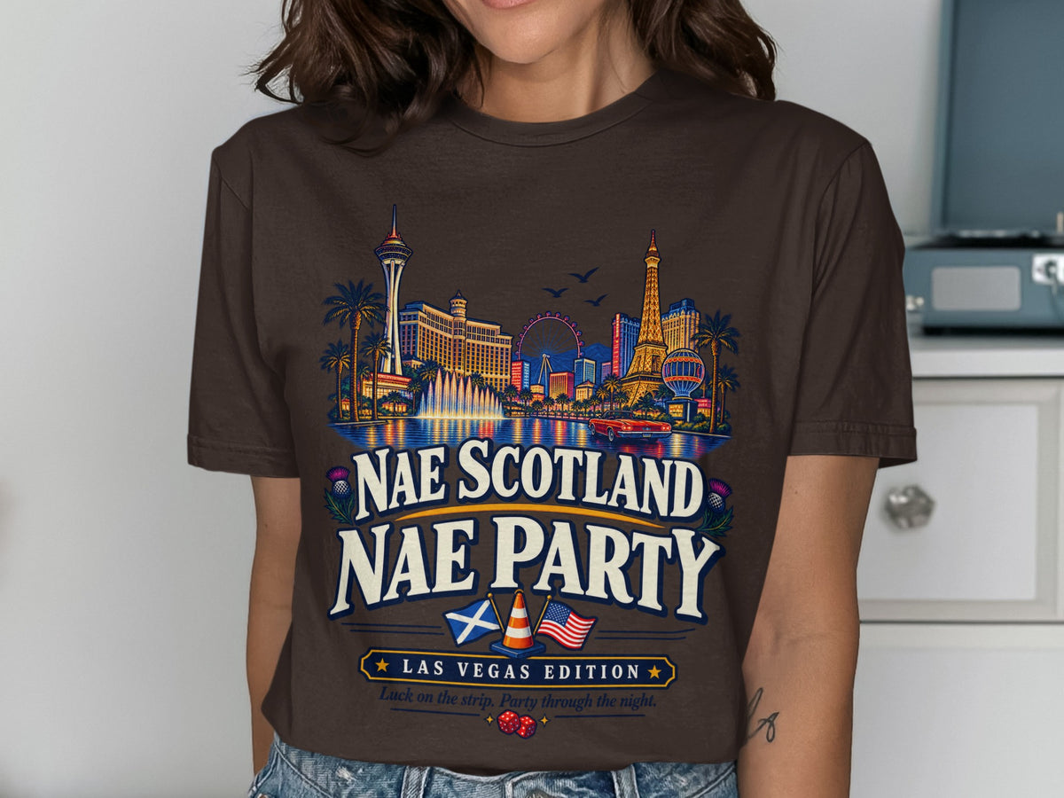Brown t-shirt with Las Vegas skyline graphic and "Nae Scotland Nae Party" text.