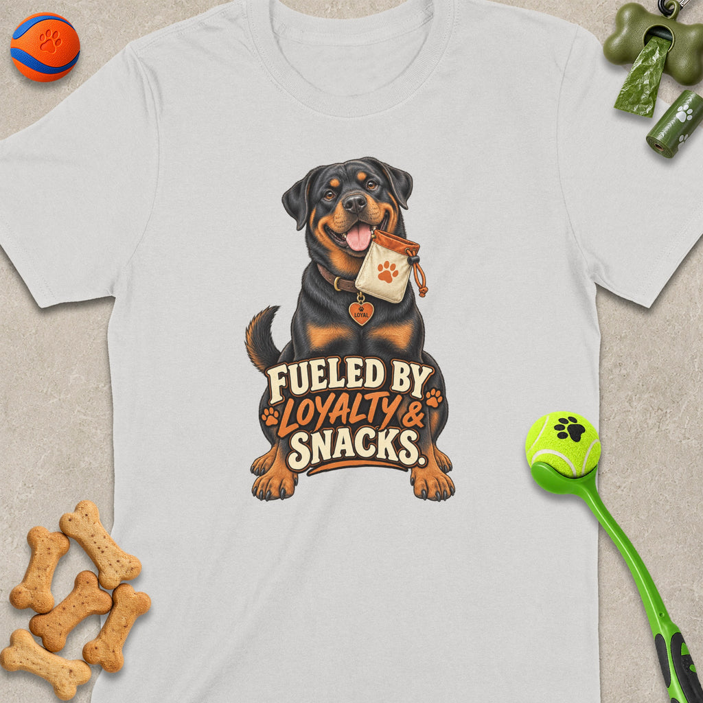 Rottweiler holding a treat bag with text "Fueled by Loyalty & Snacks".