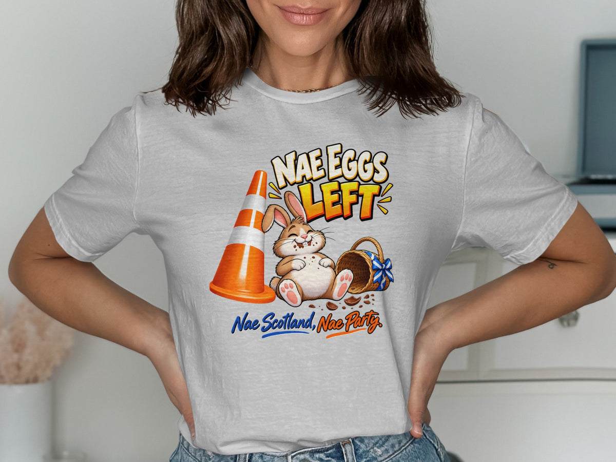 T-shirt with illustration of a rabbit, cone, and basket with text "NAE EGGS LEFT."