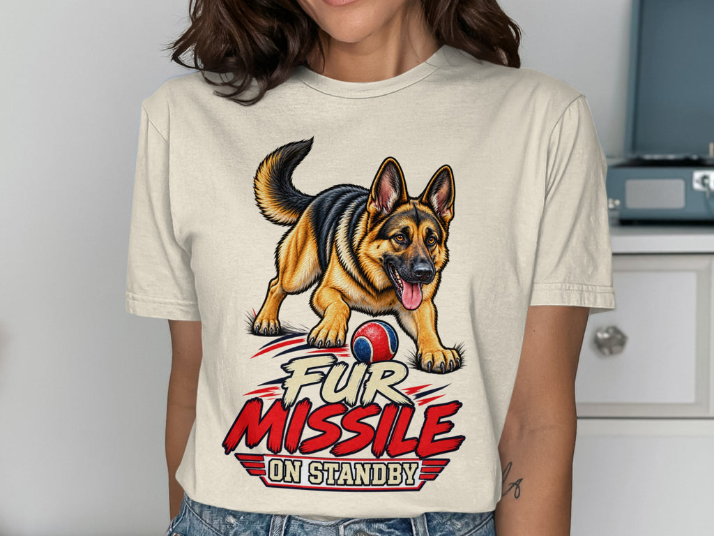 German Shepherd with ball and text "FUR MISSLE ON STANDBY" on a shirt.