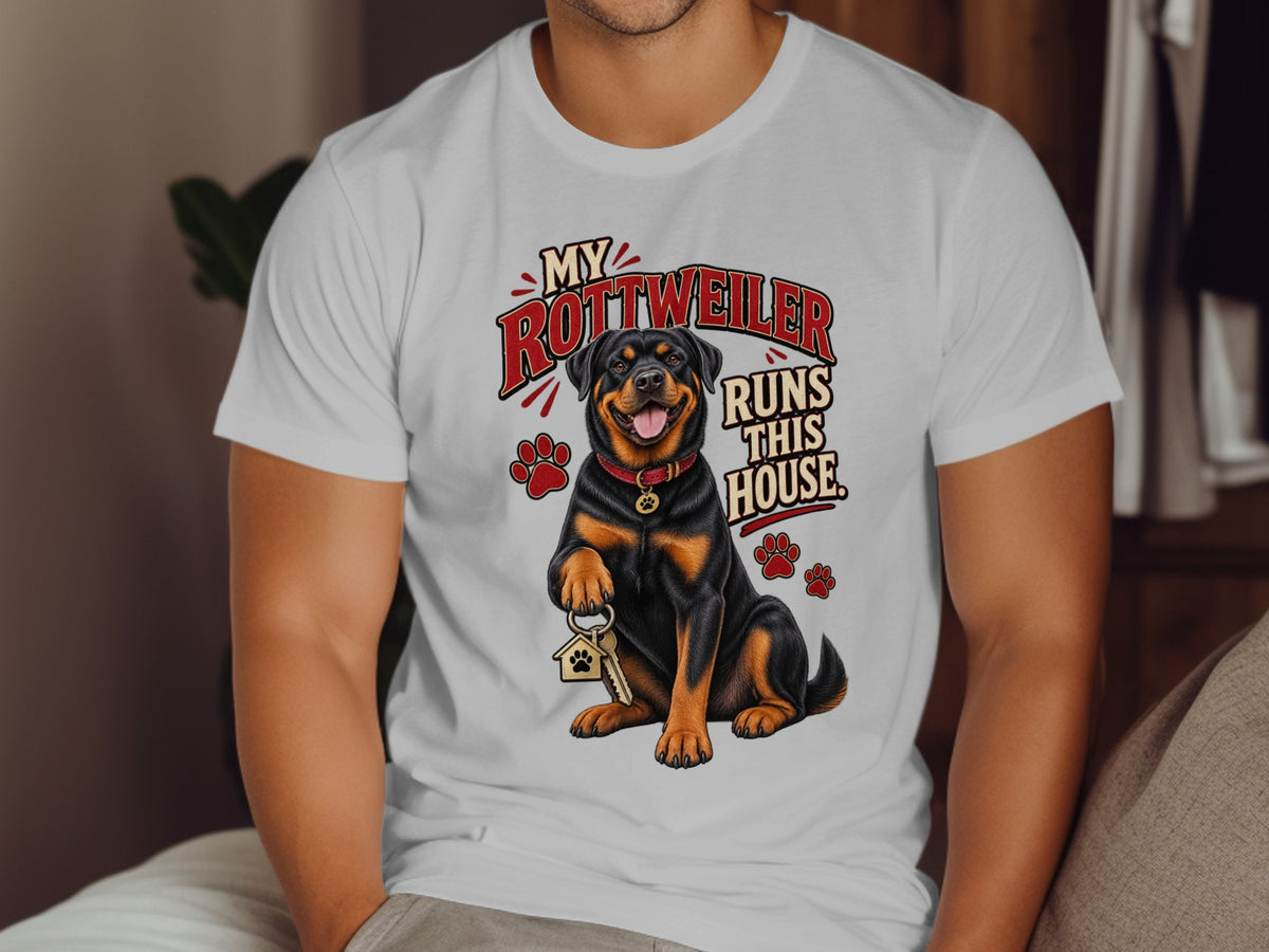 Rottweiler with keys and text "My Rottweiler Runs This House" on a white t-shirt.