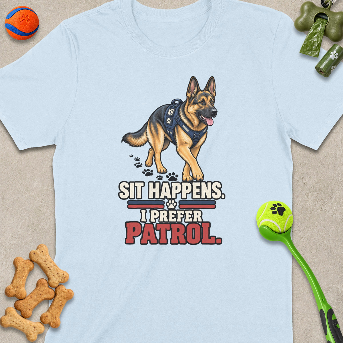 Light blue t-shirt with a K9 German Shepherd graphic and text "Sit Happens. I Prefer Patrol."