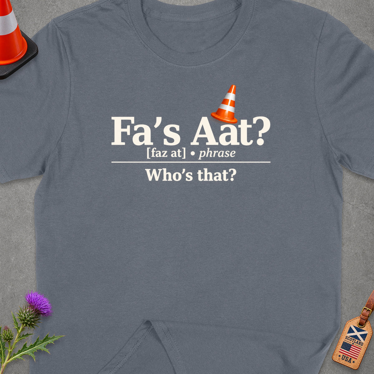 T-shirt with "Fa's Aat? Who's that?" in text, traffic cone icon.
