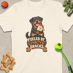 Rottweiler with "Fueled by Loyalty & Snacks" text, holding treat bag.
