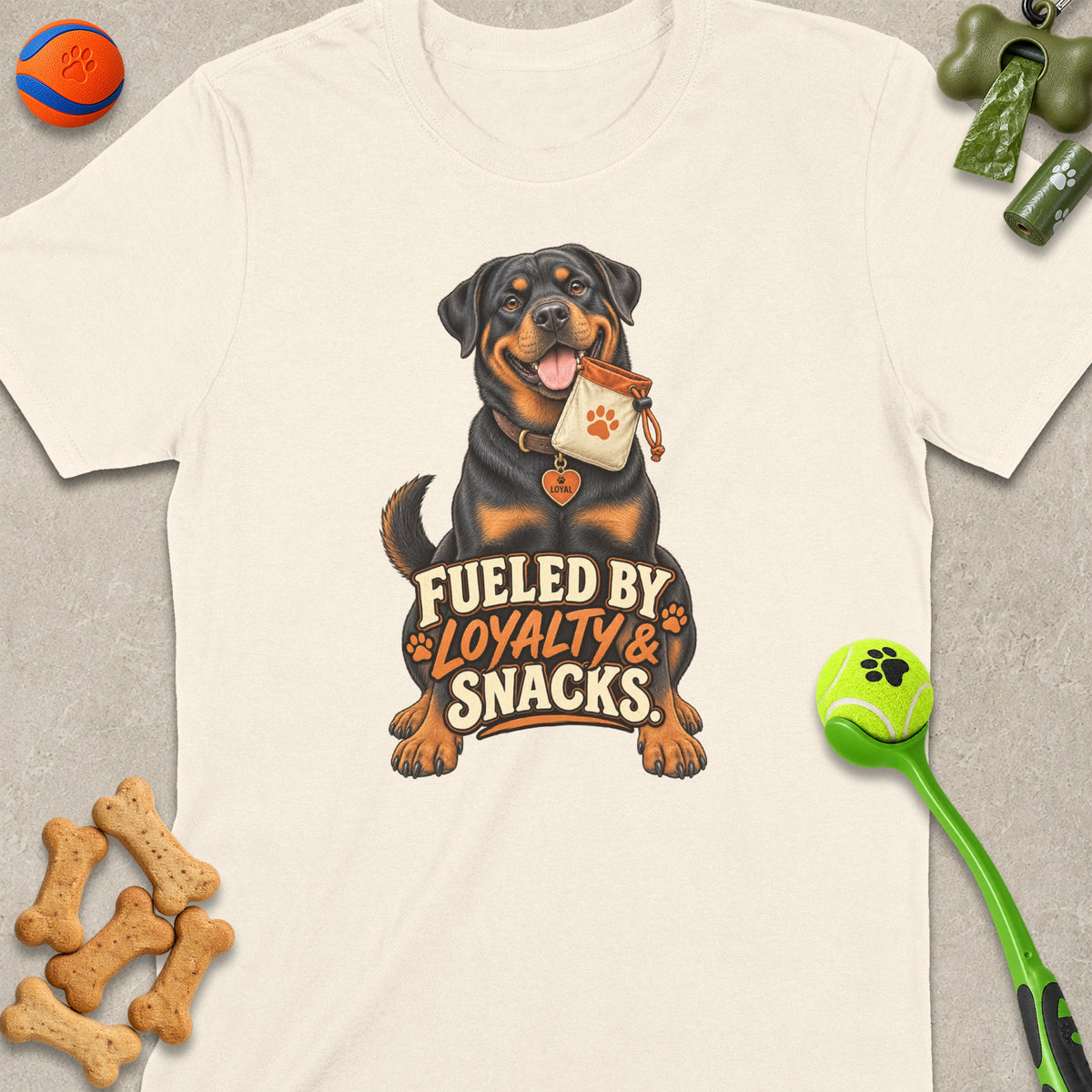 Rottweiler with "Fueled by Loyalty & Snacks" text, holding treat bag.