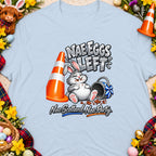 Cartoon bunny sits next to an orange cone, text reads "Nae Eggs Left".