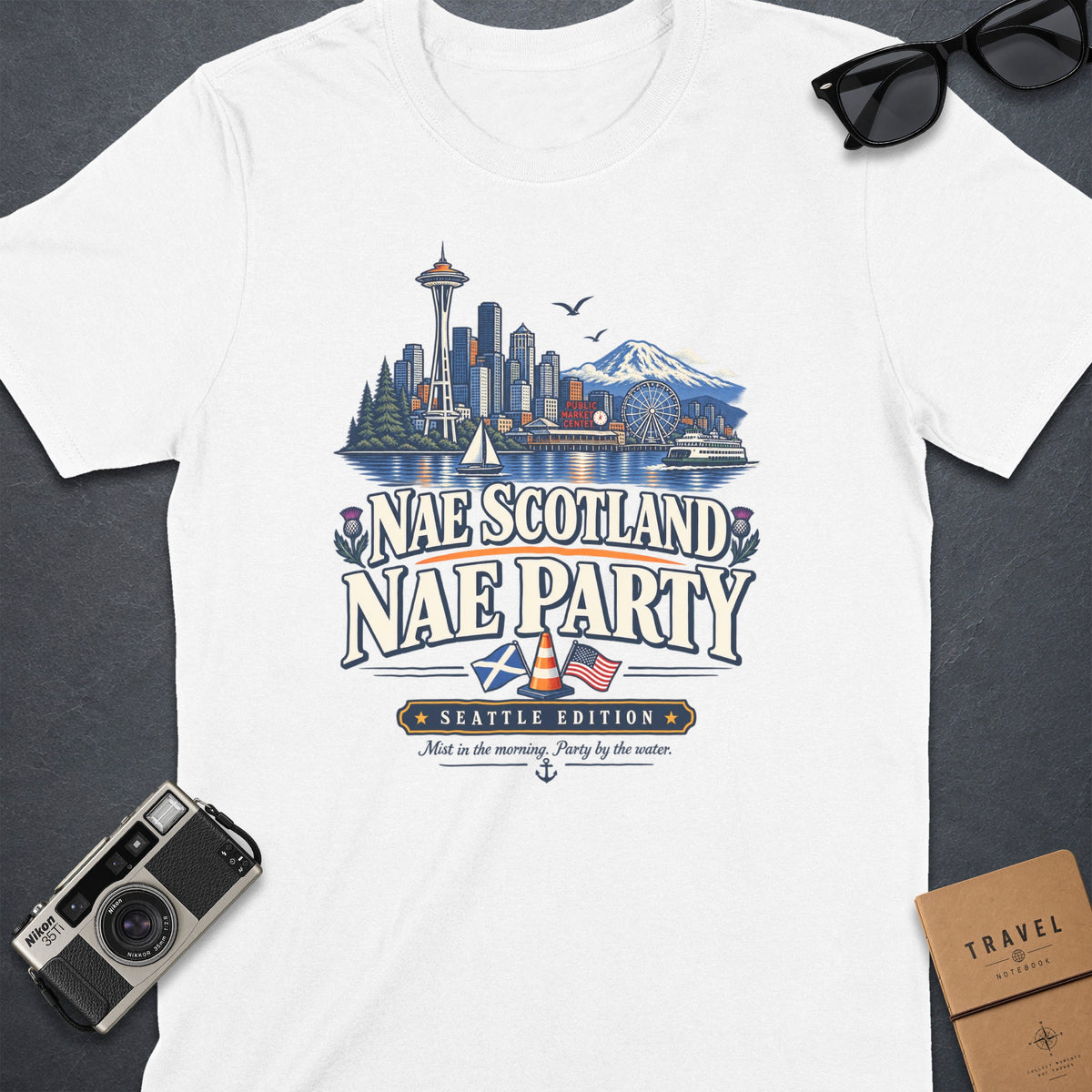 White t-shirt with "Nae Scotland Nae Party Seattle Edition" graphic.
