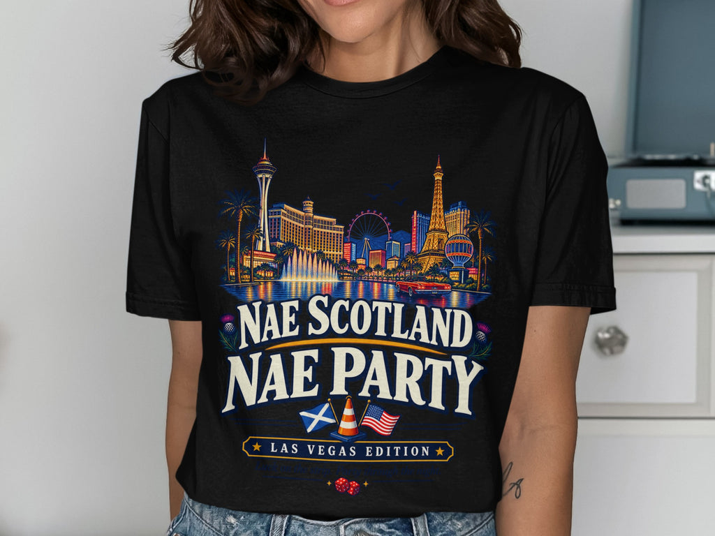 T-shirt with Las Vegas skyline, Scottish and American flags, and text.
