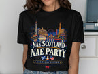 T-shirt with Las Vegas skyline, Scottish and American flags, and text.