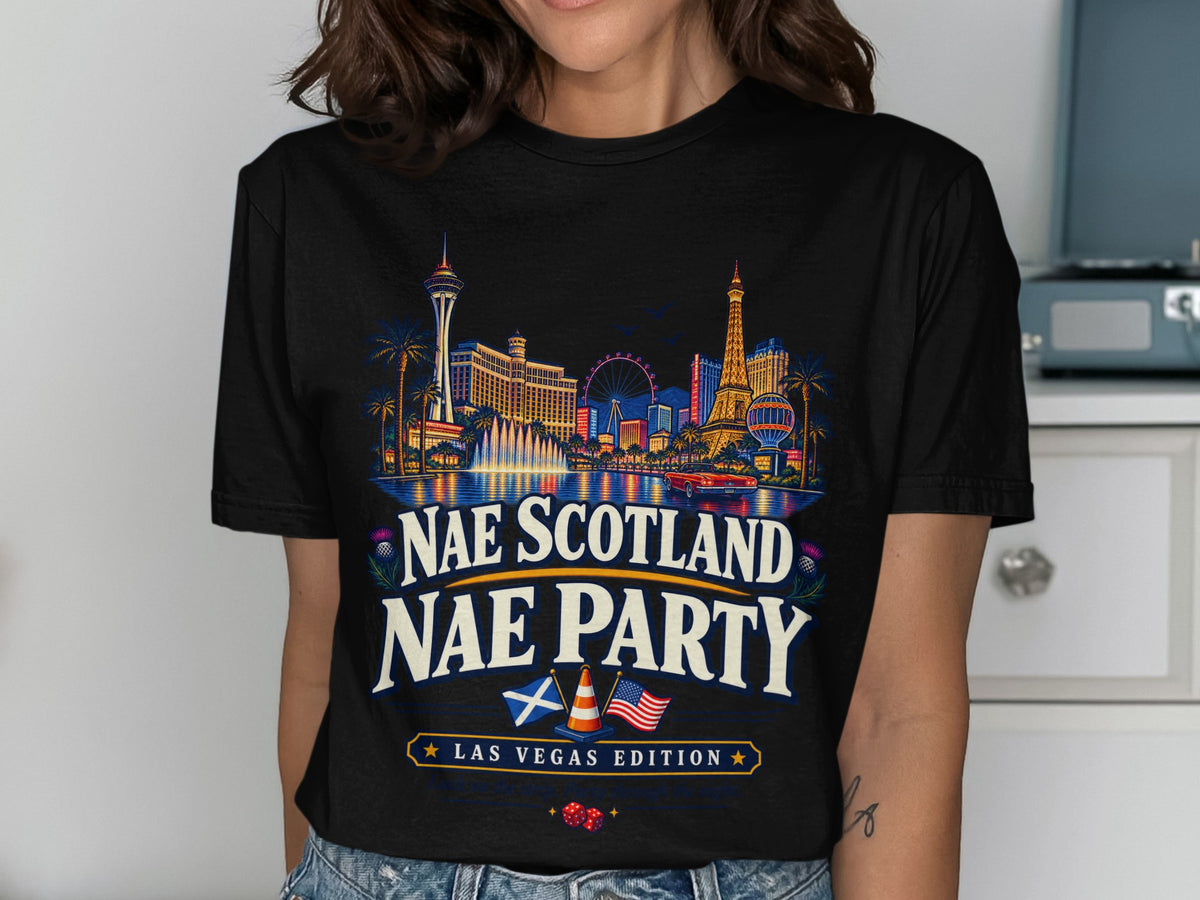 T-shirt with Las Vegas skyline, Scottish and American flags, and text.