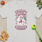 White t-shirt with a poodle graphic reading "Groomed to Perfection Behaved By Accident."