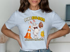 White t-shirt with "PURE EGG-STRA" text, a bunny holding an egg, traffic cone, and chick.