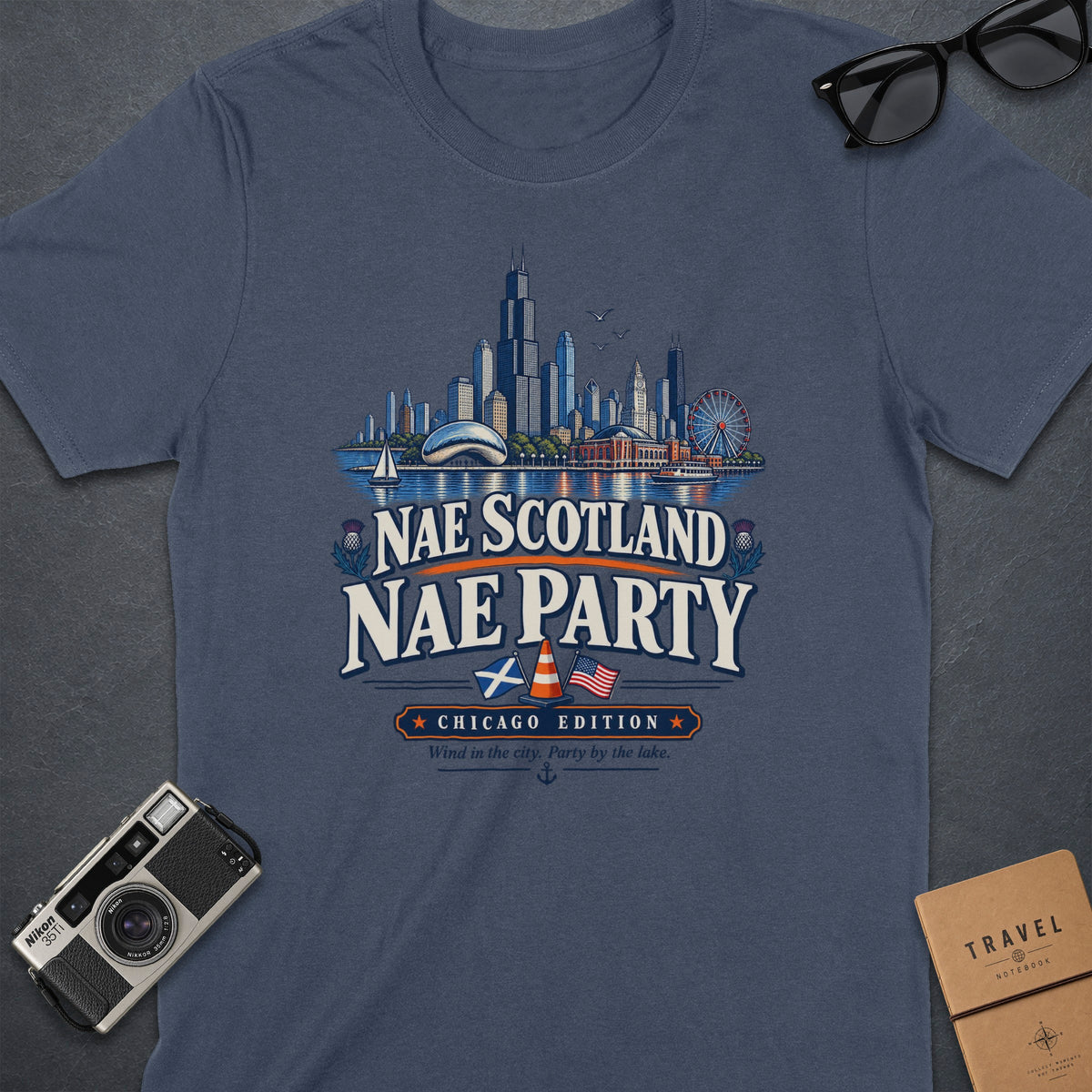 Navy t-shirt with "Nae Scotland Nae Party Chicago Edition" text and Chicago skyline graphic.