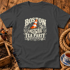 A dark gray t-shirt featuring a Boston Tea Party graphic with a traffic cone in a crate.